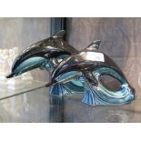 Two Poole Pottery figures of dolphins leaping 18cm and 15cm high