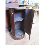 A Victorian mahogany cylindrical pot cupboard, the marble inset top over a cupboard door and