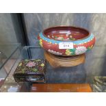 A cloisonne rectangular box with black ground and floral design 9cm wide and a cloisonne bowl 21cm