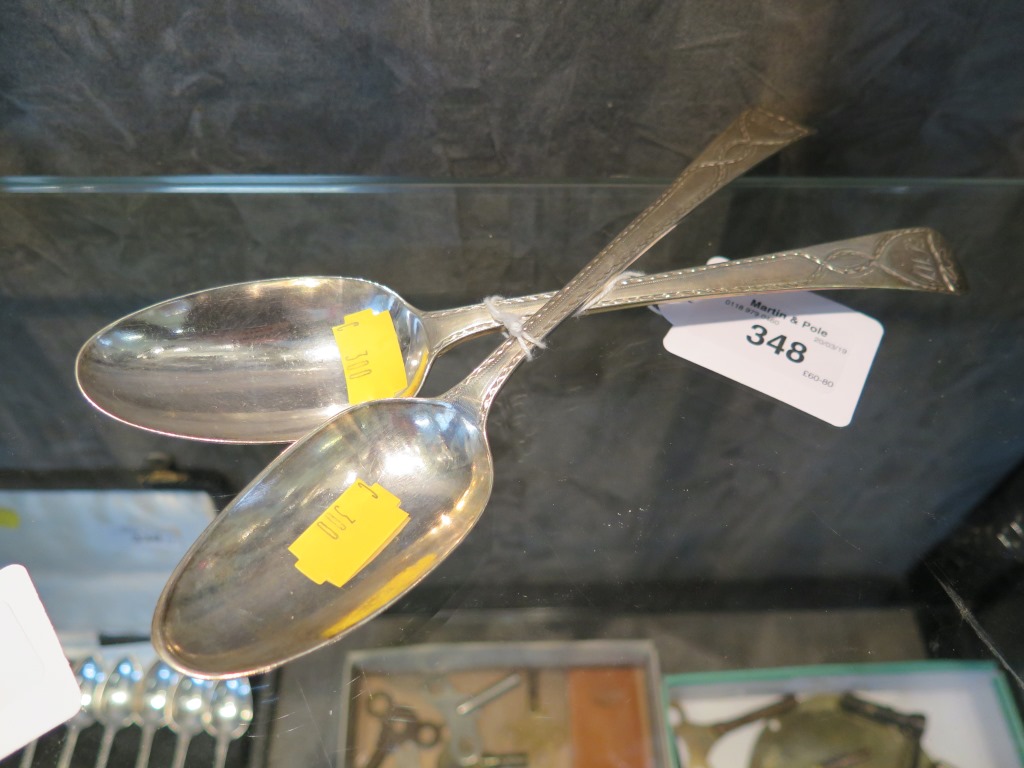 A pair of George III silver serving spoons with bright cut decoration,1776