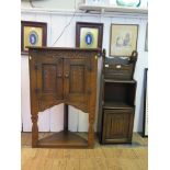 A carved oak corner cabinet 97cm high, and a carved oak magazine rack (2)