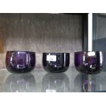 Three Georgian amethyst coloured glass finger bowls c1820