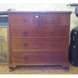 A 19th century mahogany chest of drawers, the moulded top with lambrequin frieze over two short
