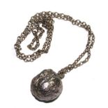 A silver walnut pendant and chain