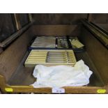 A collection of plated tea knives and tea spoons in original cases