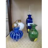 A collection of four glass scent bottles including Murano and silver overlay decoration