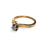 An 18 carat gold ring set with single diamond