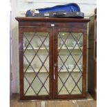 A walnut bookcase top, the protruding cornice over a pair of diamond glazed doors, 96cm x 109cm