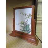 A small oriental desk/table screen with double sided glazed tile decorated with enamelled birds