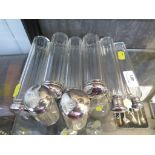 Eight silver topped glass toilette bottles