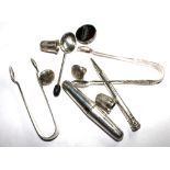 Ten items, some silver, to include thimbles, sugar nips, pencil cork screw