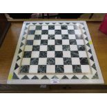 A good marble inlaid chess or draughts board of various colours 41cm x 41cm