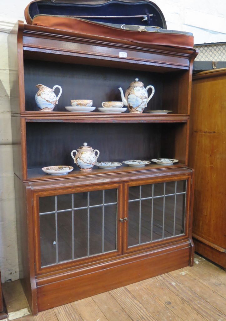 An Edwardian mahogany and satinwood crossbanded stacking bookcase, 'The Oxford' by Wm Baxter & Co,