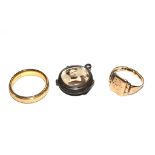 An 18 carat gold wedding ring and small locket, etc