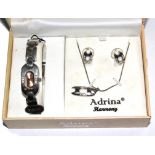 An Adrina watch in original box with matching earrings and pendant