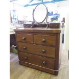 A Victorian mahogany dressing chest, with two trinket drawers, two short and two long drawers, and