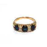 An 18 carat gold sapphire and diamond ring