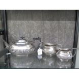 A three piece silver plated tea set (poor condition)