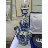 A good Dutch Delft blue and white floral decorated double gourd shaped vase