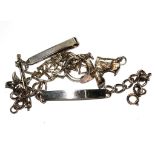 A collection of silver items to include money clip, I.D. bracelet, silver brooch, etc