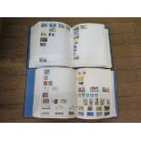 Two Minkus global postage stamp albums 1960s-1990s