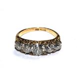 An 18 carat gold five stone diamond ring