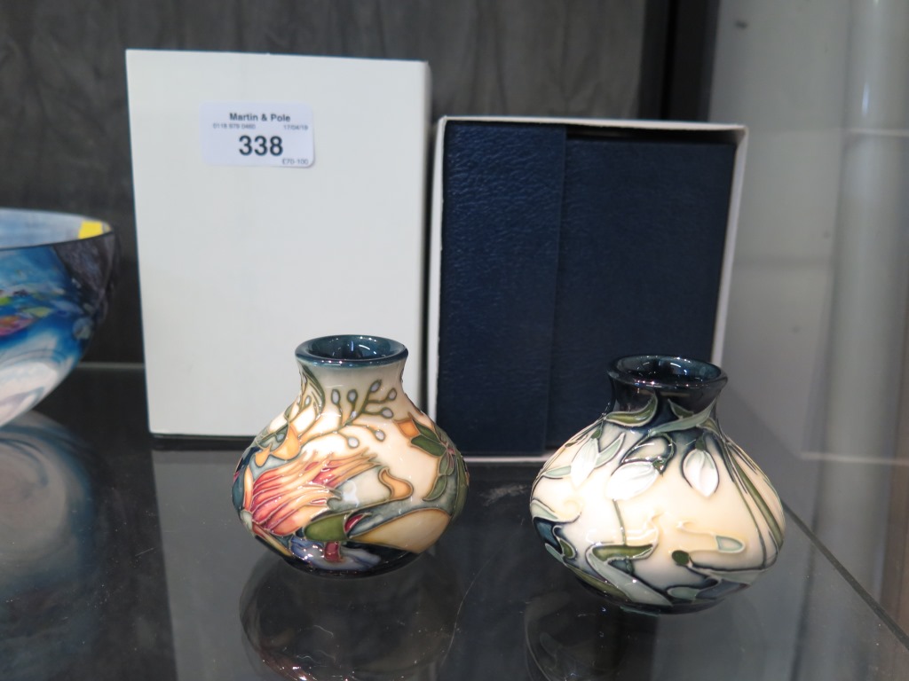 Two Moorcroft miniature vases, Summer Prairie and Nivalis, both marked and with original boxes,
