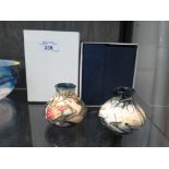 Two Moorcroft miniature vases, Summer Prairie and Nivalis, both marked and with original boxes,