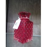 A Whitefriars style glass chess board design vase in ruby red, 14.5cm high