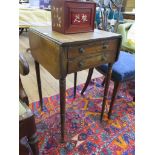 An early 19th century mahogany Pembroke table, with two frieze drawers on ring turned tapering