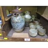 An Abuja coffee set in blue/green glaze including six coffee cups and saucers, another saucer, two