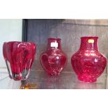 A pair of Whitefriars style red glass baluster vases, 20cm high and a molar glass vase in red 16.5cm