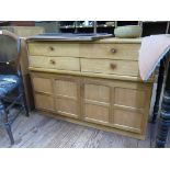 A Nathan teak side cabinet, with four short drawers over a pair of panelled doors labelled, 102cm