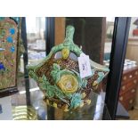 A Victorian Majolica naturalistic basket 22cm high and a square tapering Majolica vase 32cm high (