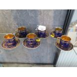 A set of six Royal Vienna blue and gilt coffee cans and saucers (6)