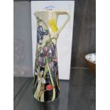 A Moorcroft Pottery Meadow design jug 18.5cm high in original box