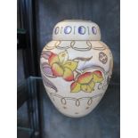 A Bursley ware Charlotte Rhead design vase and cover, with yellow and blue floral design 14.5cm