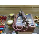 An early 20th century house telephone by British LM Ericsson, and a pair of brass door knobs,