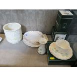 Three Belleek shell shaped dishes, a clover teacup, saucer and plate set and two vases