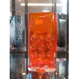 A Whitefriars glass circular hobnail or 'mobile phone' vase, in tangerine, 16.5cm high