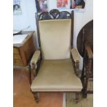 A pair of Edwardian stained beech armchairs, the Art Nouveau style top rails over padded backs and