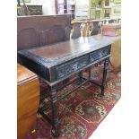 A Victorian hall table, the leather inset top over scroll and mask carved drawers on turned legs