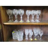 A set of six sherry glasses, with black cane stems, a set of four whisky tumblers and a set of