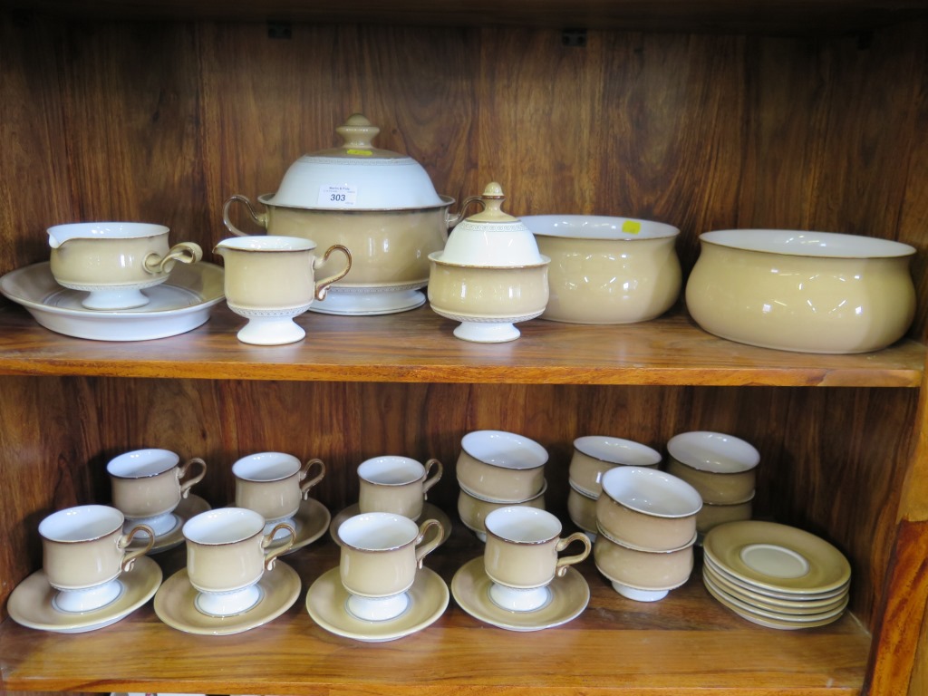 A Denby stoneware part dinner service, including tea cups, soup bowls, tureen and bowls