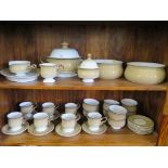 A Denby stoneware part dinner service, including tea cups, soup bowls, tureen and bowls