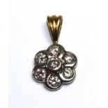 A seven stone diamond cluster pendant