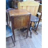 A mahogany bedside cupboard, the boxwood lined door on sqaure tapering legs, 40cm wide and a