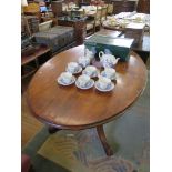 A Victorian mahogany oval tilt top breakfast table, with bulbous support and four cabriole legs with