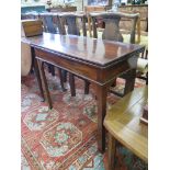 A mahogany foldover tea table, the rectangular top over a plain frieze on chamfered legs, 84cm wide