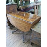 A Regency mahogany and ebony lined Pembroke table with frieze drawer on a turned support and four